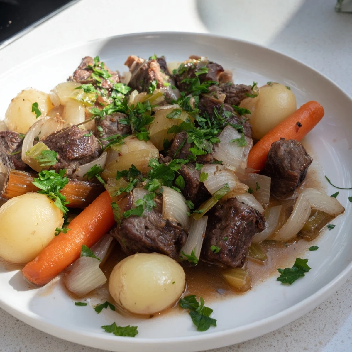 A ladle of St. Patricks Day Irish Stew reveals tender lamb chunks and soft root vegetables in a savory, aromatic broth.