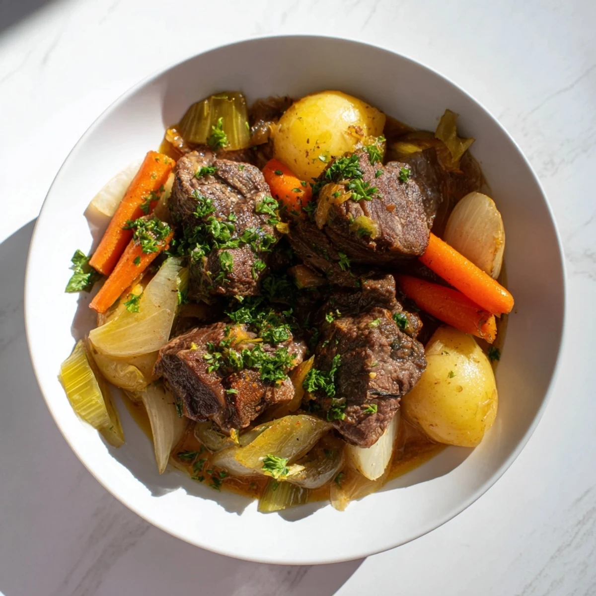 Served in a rustic bowl, the St. Patricks Day Irish Stew is garnished with fresh parsley and ready to enjoy.