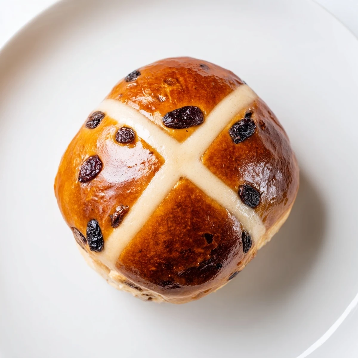 Warm, fragrant Hot Cross Buns fresh from the oven, featuring delicate crosses and a soft, spiced crumb.  