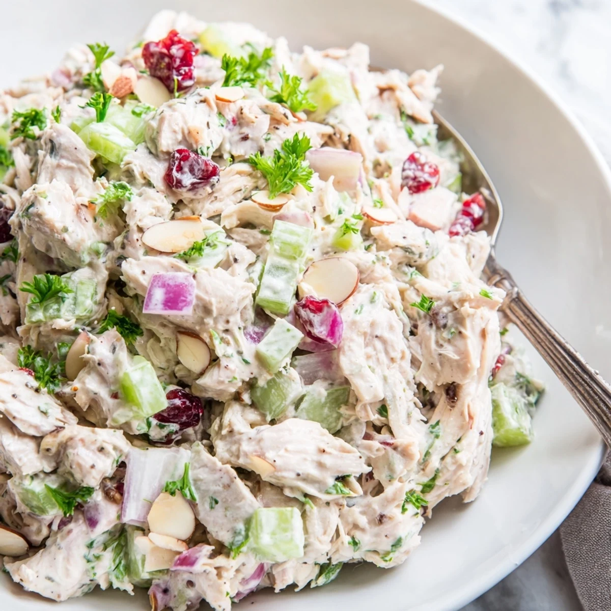 Light and tangy Greek yogurt rotisserie chicken salad featuring colorful vegetables and creamy dressing