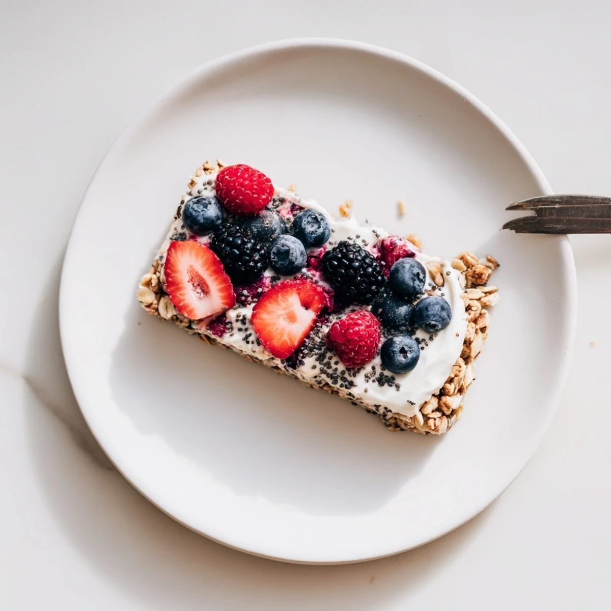 Homemade frozen yogurt berry granola bars feature crunchy granola base topped with sweet mixed berries and smooth Greek yogurt layer