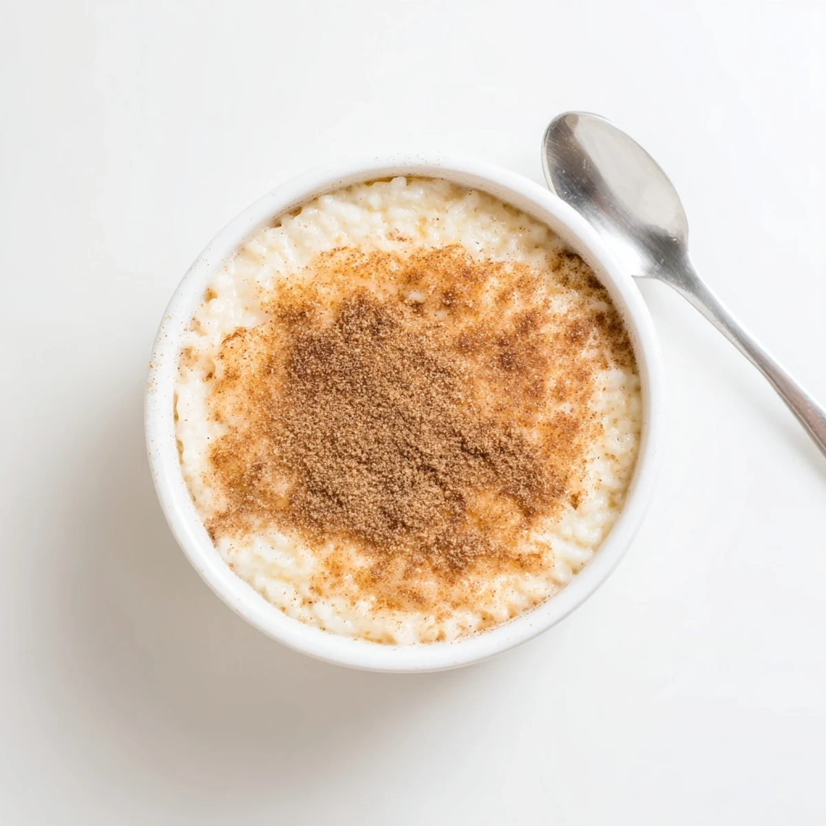 Silky Portuguese rice custard with a caramelized cinnamon crust served in individual dishes
