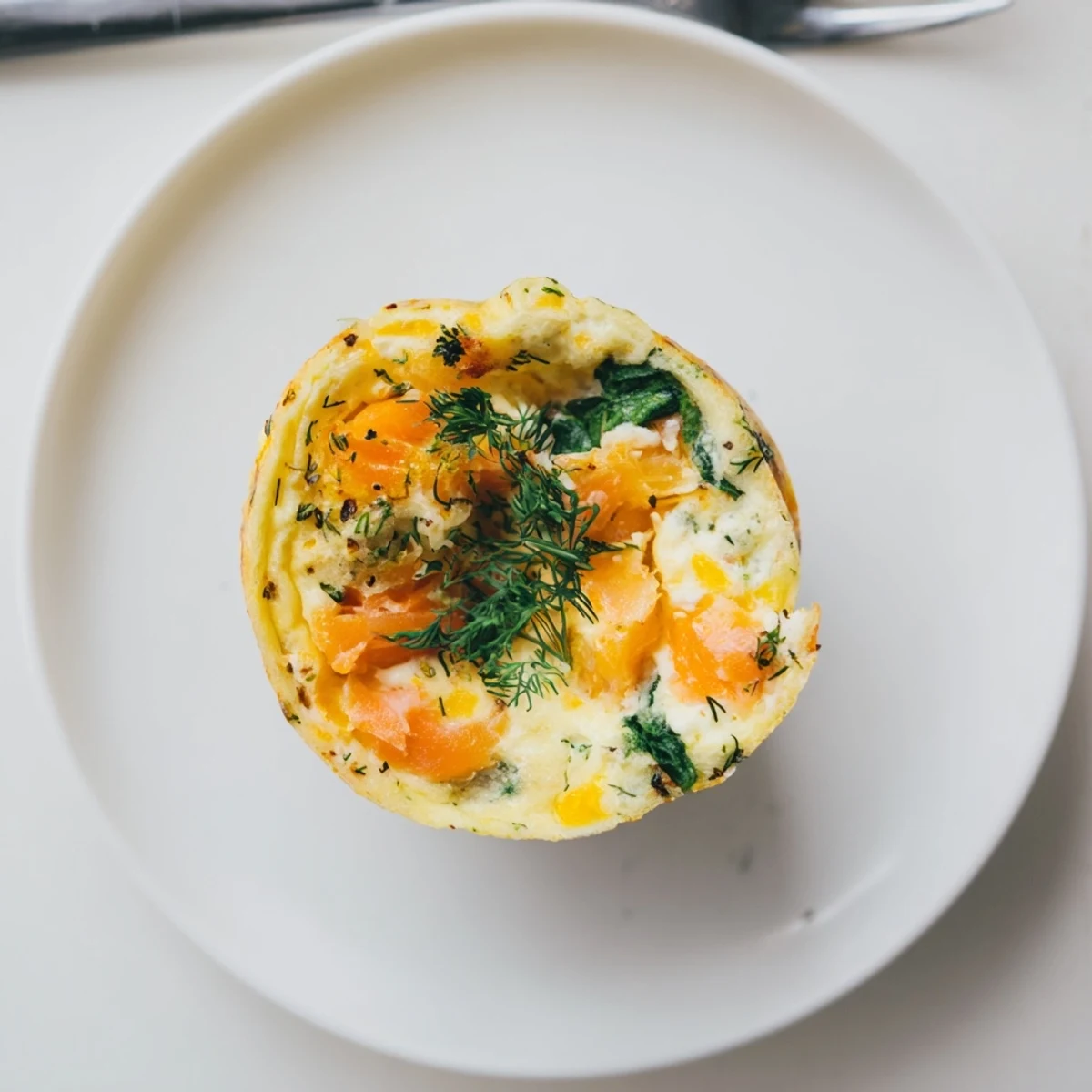 Fluffy eggs and flaky salmon baked into Smoked Salmon Egg Muffins for brunch.