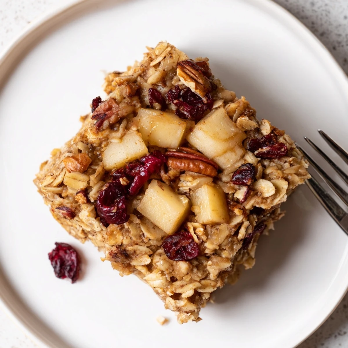 Delicious Apple Cinnamon Oatmeal Bake Recipe For Mornings served warm with yogurt