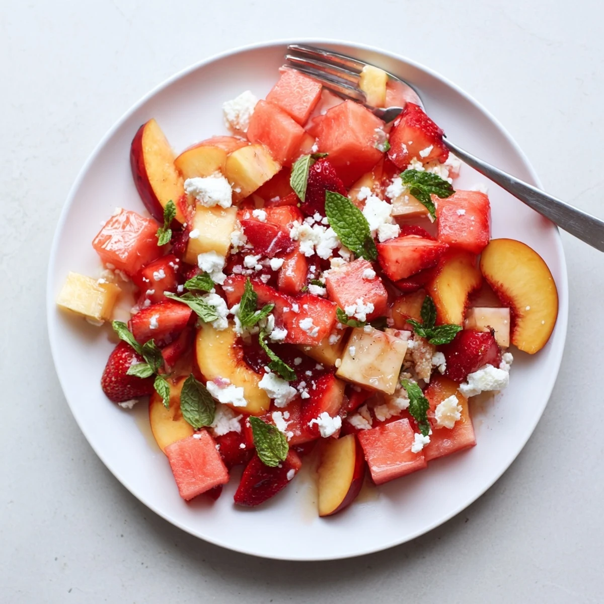 Juicy cubed watermelon and sliced peaches tossed in zesty lime dressing for summer peach watermelon salad