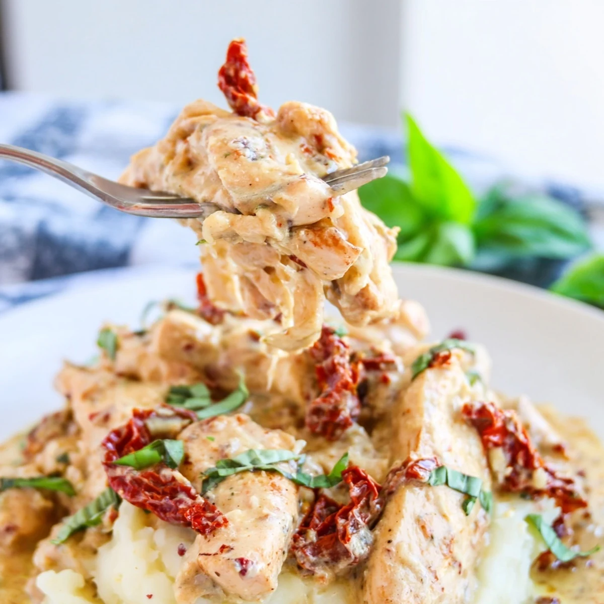Creamy Dump And Go Crockpot Marry Me Chicken simmering with sun-dried tomatoes