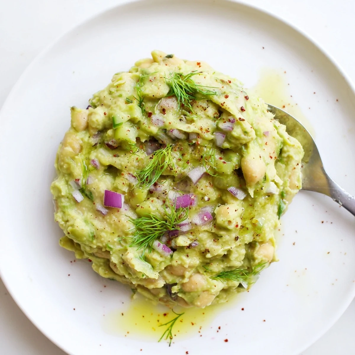 Creamy Smashed Chickpea Avocado Pickle on toast with bright lemon, herbs