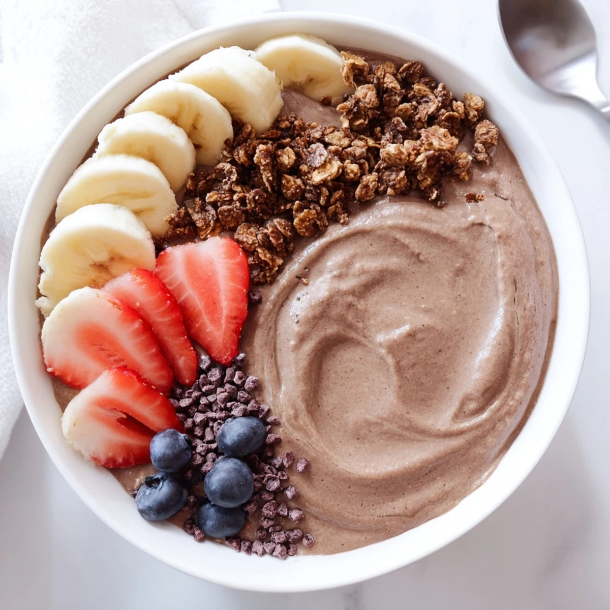 Coffee Protein Smoothie Bowl Recipe served chilled with almond butter swirl and banana