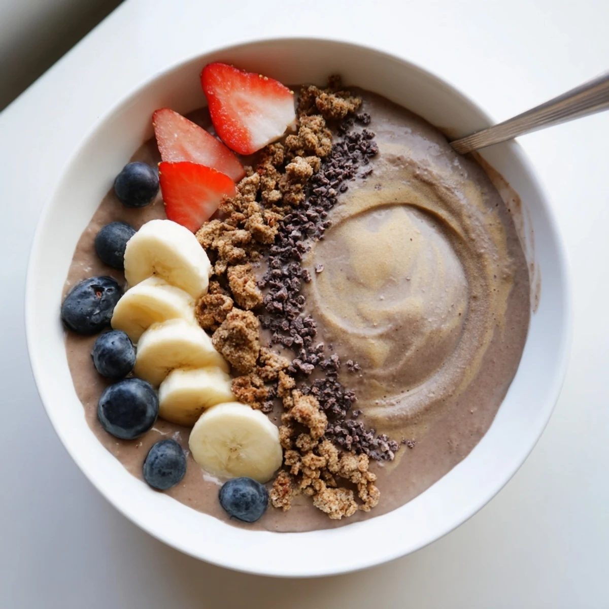 Chilled Coffee Protein Smoothie Bowl Recipe layered with banana slices, chia seeds, granola