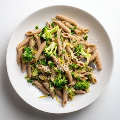 A serving of Easy Healthy Broccoli Pasta in a rustic bowl, garnished with fresh parsley and a sprinkle of Parmesan, ready for a nutritious Italian dinner.