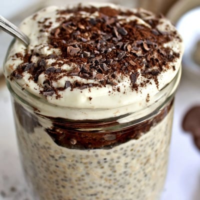 Tiramisu overnight oats served chilled with rich mascarpone and dark chocolate shavings